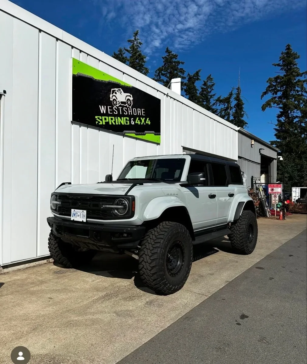 White Ford Bronco outside the Westshore Spring and 4x4 shop