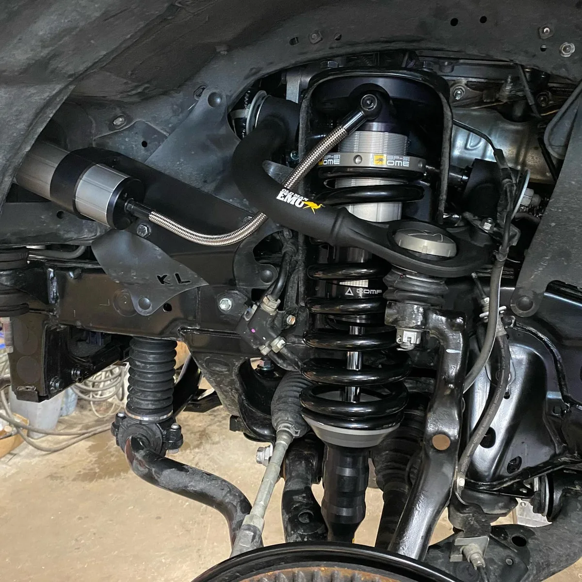Close detail of a vehicle spring and shock absorber